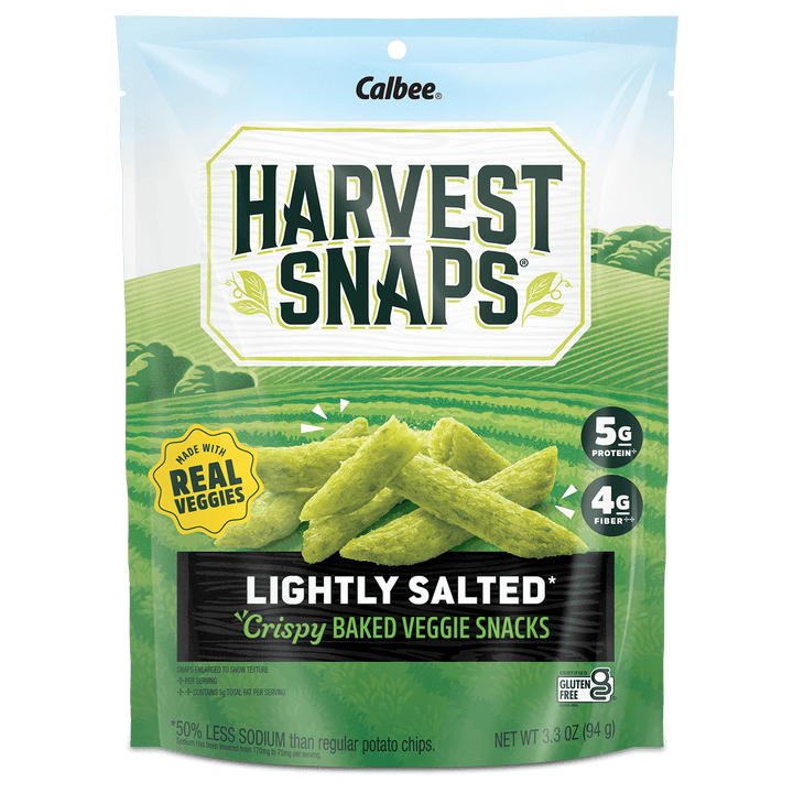 Packaging of Harvest Snaps Lightly Salted Crispy Baked Veggie Snacks. Features farm imagery, labels for 5g protein, 4g fiber, and gluten-free.