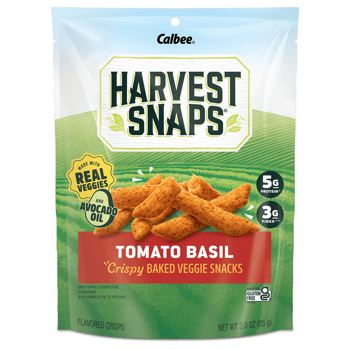 A 3.0 oz bag of Calbee Harvest Snaps Tomato Basil flavored crisps, showing baked veggie snacks on the front of the packaging.