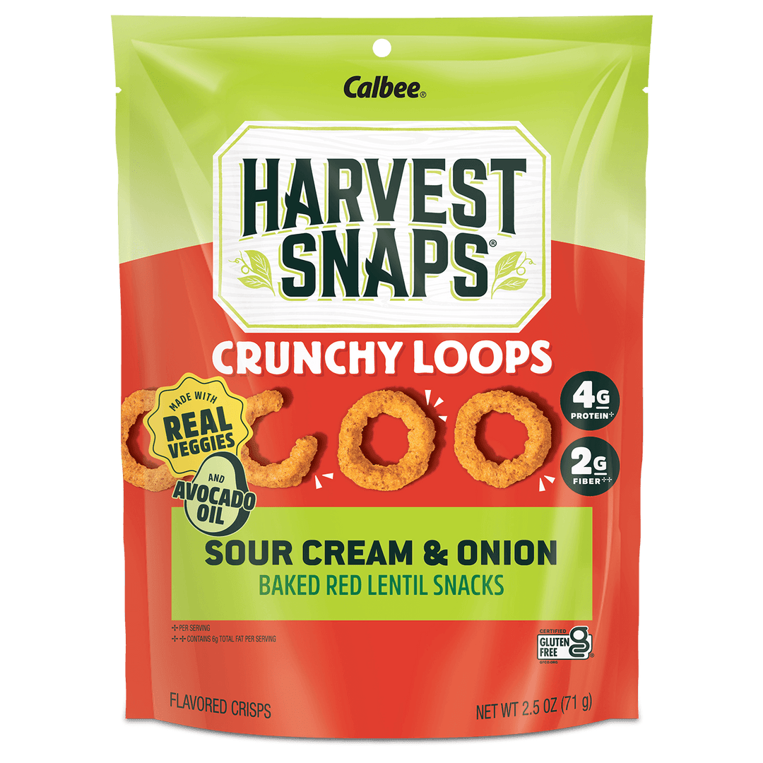 A bag of Calbee Harvest Snaps Crunchy Loops Sour Cream & Onion Baked Red Lentil Snacks, featuring a bright red and lime green packaging design with an illustration of golden-brown crispy loops.