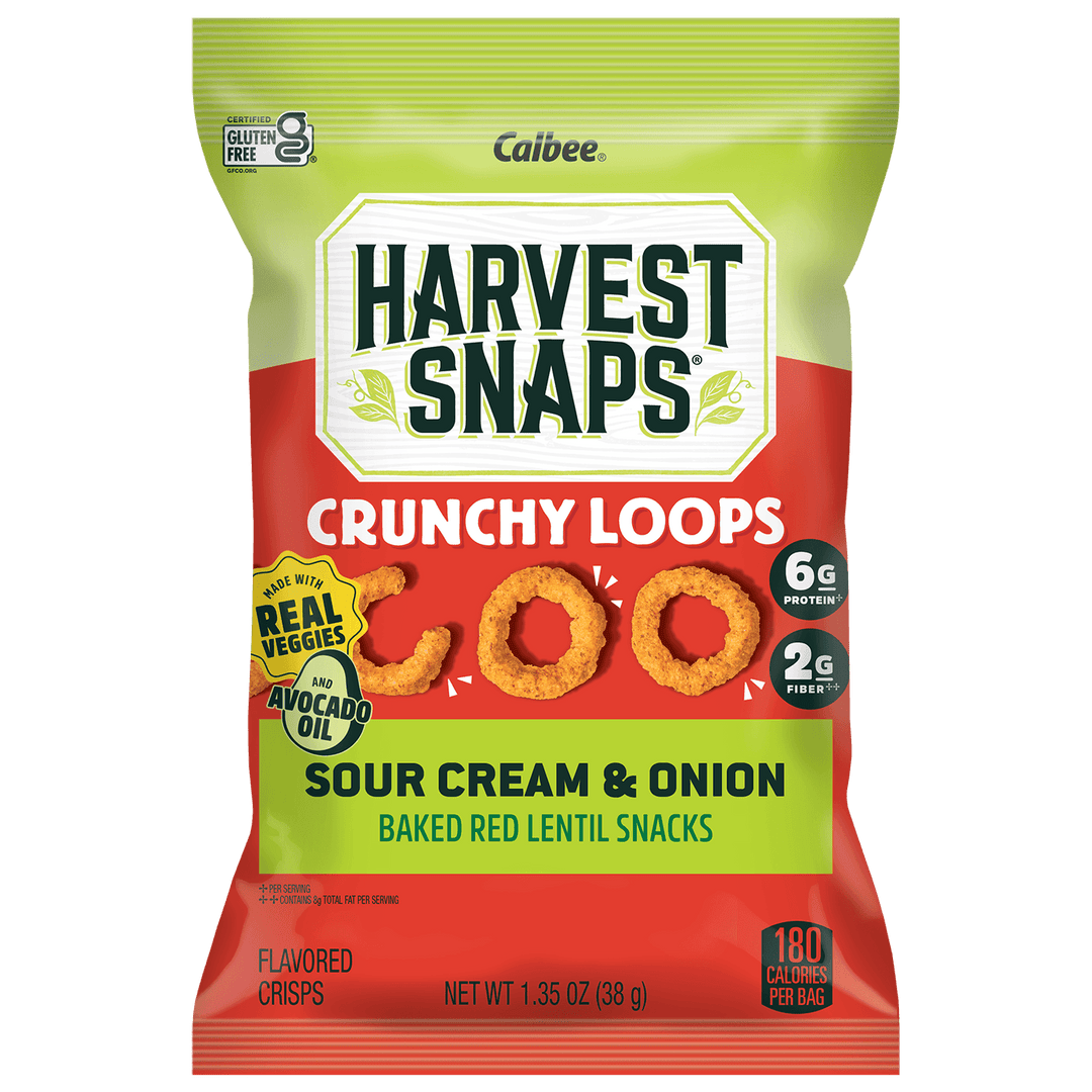 A bag of Calbee Harvest Snaps Crunchy Loops Sour Cream & Onion flavored lentil crisps. The packaging features a bright green top section and a red bottom section, with the product name and flavor clearly displayed on the front.