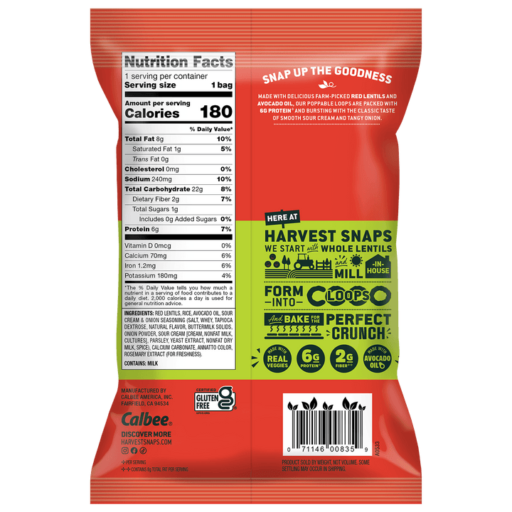 Back of a Calbee Harvest Snaps whole lentil pasta bag, showing nutrition facts, ingredients, and a green promotional graphic with icons and text on a dark orange background.