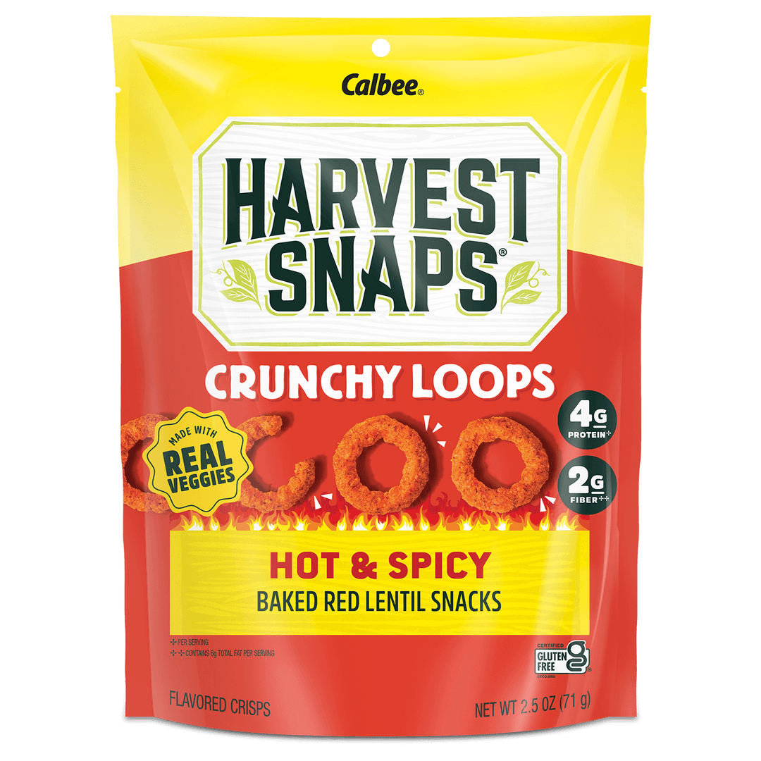 Packaging for Harvest Snaps Crunchy Loops, featuring hot and spicy baked red lentil snacks. Emphasizes real veggies, 4g protein, 2g fiber. Bright and bold design.