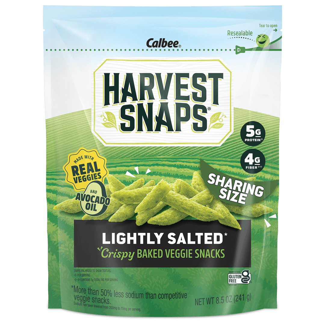 A bag of Calbee Harvest Snaps Lightly Salted Crispy Baked Veggie Snacks in a resealable green and white stand-up pouch, with images of green vegetable sticks on the front.