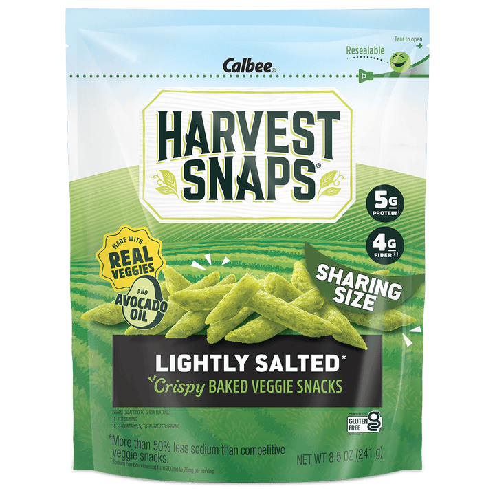 A bag of Calbee Harvest Snaps Lightly Salted Crispy Baked Veggie Snacks in a resealable green and white stand-up pouch, with images of green vegetable sticks on the front.