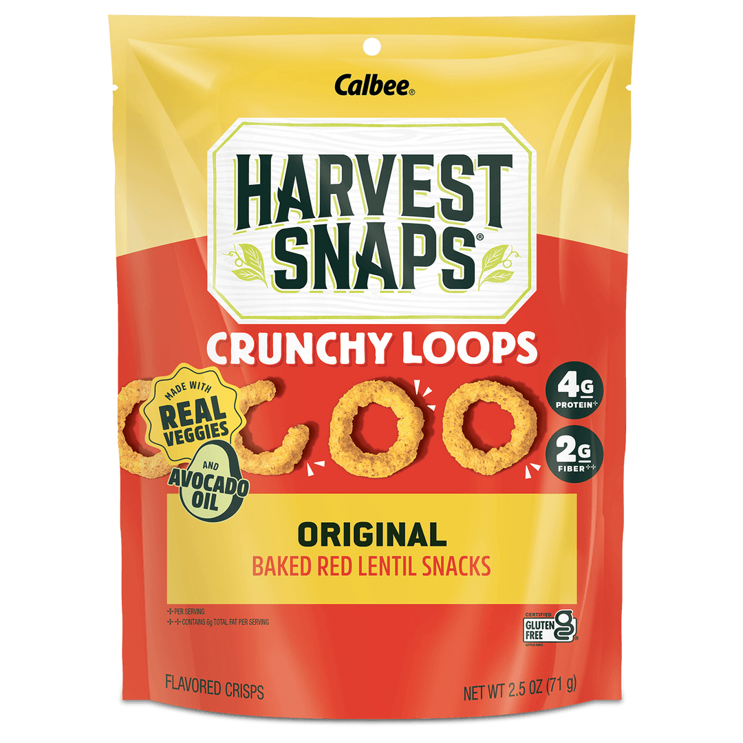 A 2.5 oz bag of Calbee Harvest Snaps Crunchy Loops Original Baked Red Lentil Snacks, featuring a yellow and red packaging design with illustrations of the golden-brown crispy loops.
