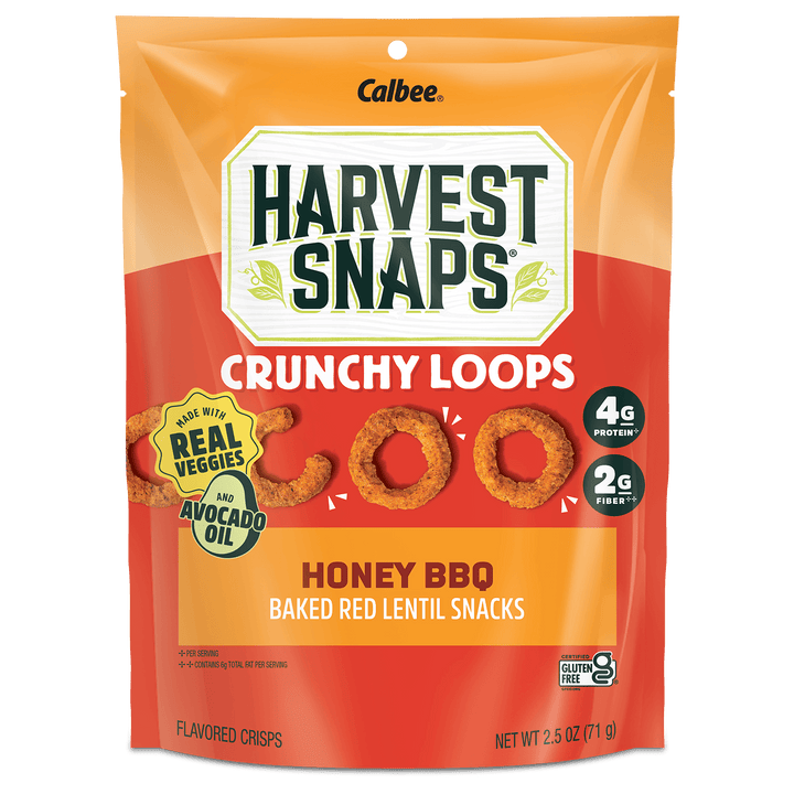 A 2.5 oz bag of Calbee Harvest Snaps Crunchy Loops Honey BBQ Baked Red Lentil Snacks, featuring a bright orange and red packaging design with the brand logo and product details.
