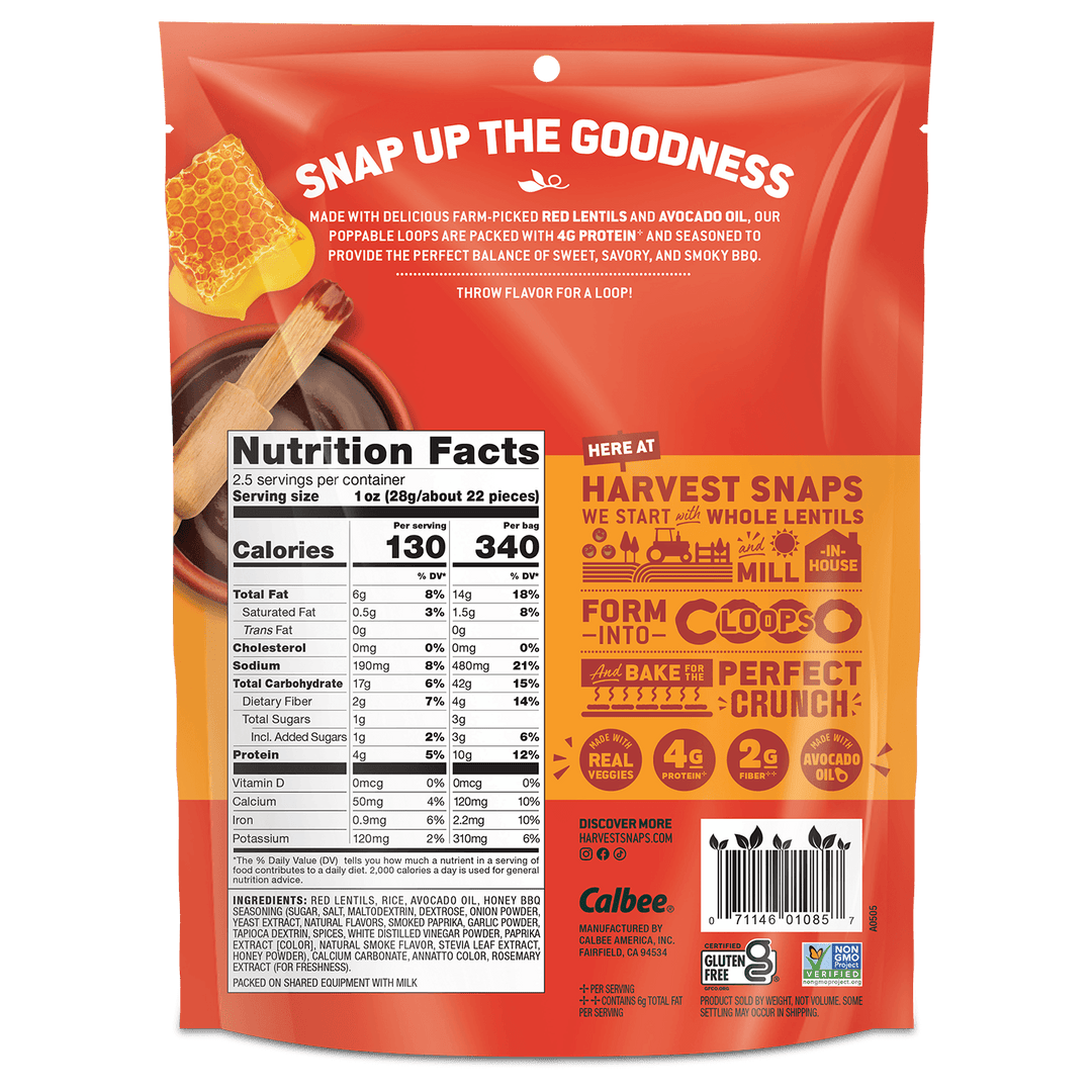 Back view of a Calbee Snap Up the Goodness whole wheat flour bag, showing nutrition facts, ingredients, and promotional text on a red and orange background.