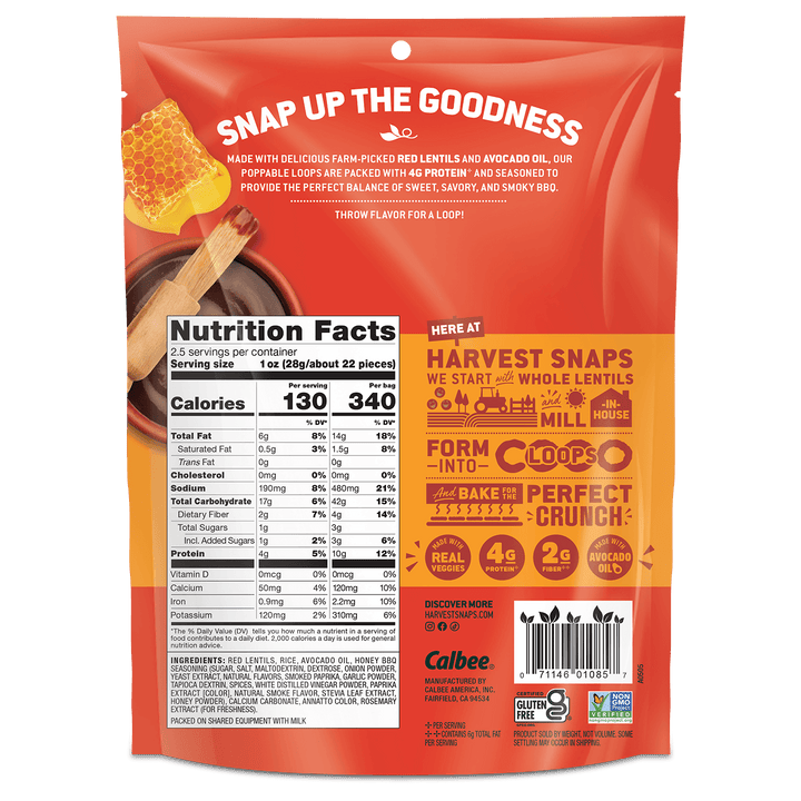 Back view of a Calbee Snap Up the Goodness whole wheat flour bag, showing nutrition facts, ingredients, and promotional text on a red and orange background.