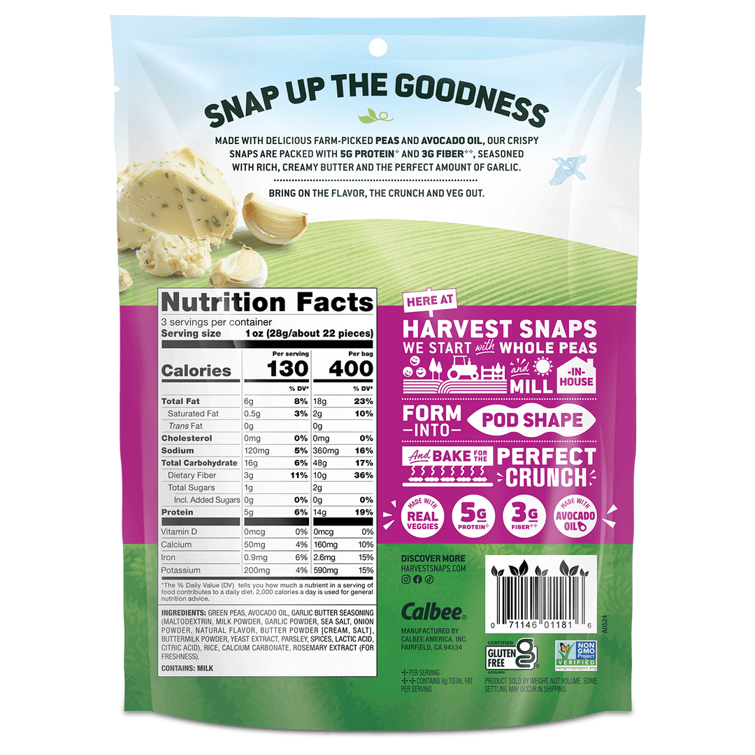 Back view of a Calbee branded bag of Harvest Snaps pea and avocado oil snack chips, featuring a white and green design with a prominent pink informational panel and product details.