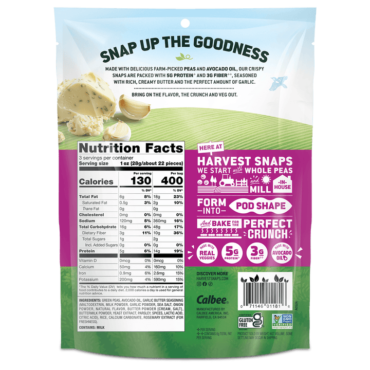 Back view of a Calbee branded bag of Harvest Snaps pea and avocado oil snack chips, featuring a white and green design with a prominent pink informational panel and product details.