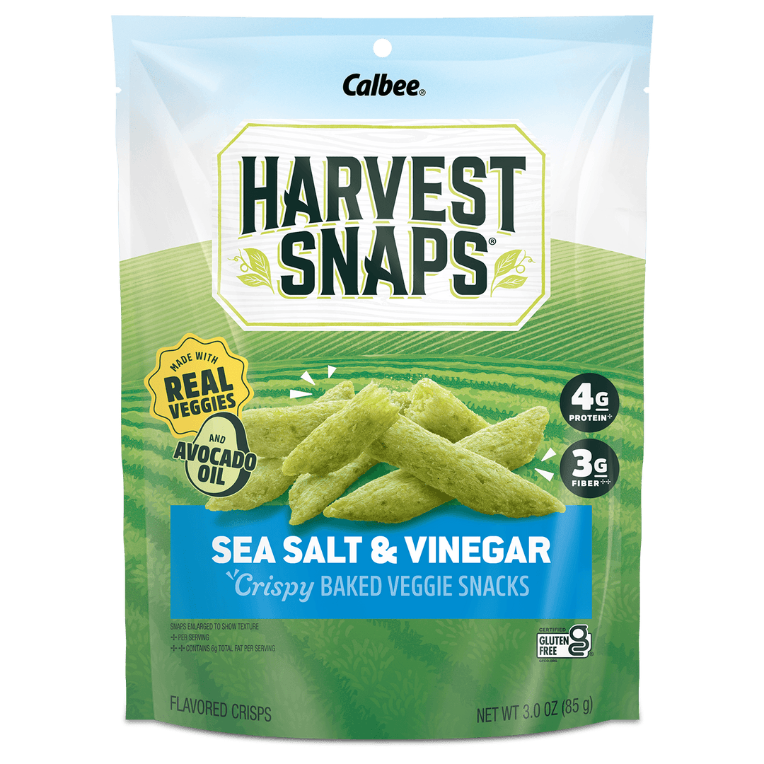 A 3.0 oz bag of Calbee Harvest Snaps Sea Salt & Vinegar crispy baked veggie snacks, featuring green ridged chips on the front of the packaging.