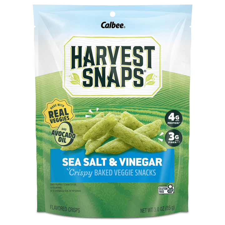 A 3.0 oz bag of Calbee Harvest Snaps Sea Salt & Vinegar crispy baked veggie snacks, featuring green ridged chips on the front of the packaging.